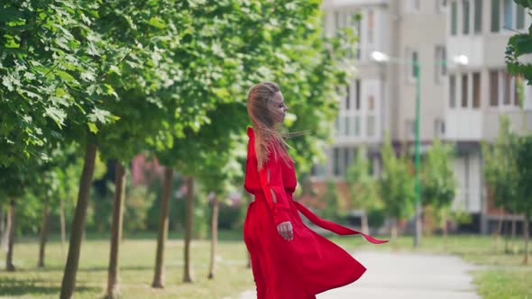 Beautiful stylish woman walking. Fashion woman portrait of young pretty trendy girl posing at the ci