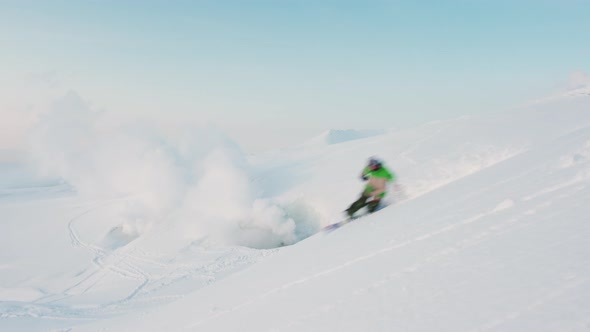 Snowboarding Powder Turns Riding Down Hill In Front Of Volcano Eruption