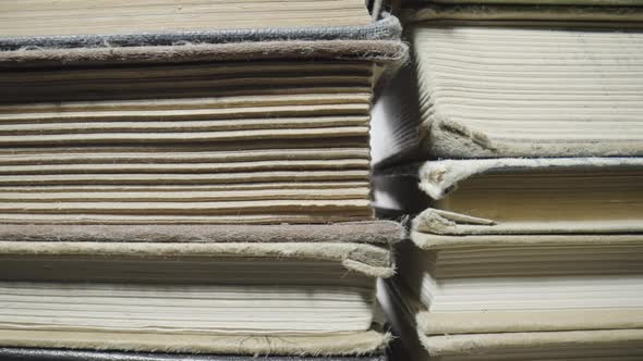 Stacks of Books in Natural Covers Lying on the Table in the Library