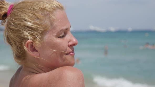 Pretty blonde  woman on  French coast 4K 2160p 30fps UltraHD footage - Beach enjoying and dreaming b