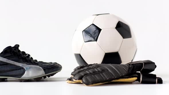 Soccer Ball, Boots and Gloves on White Background