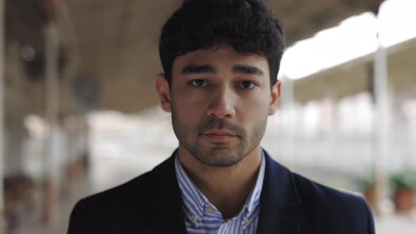 Pensive Businessman Standing Alone on Station