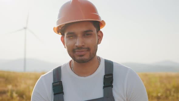 Professional Technician in Helmet and Overalls Smiling Oj Camera While Standing