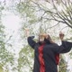 Attractive Young Lady Smiling Wearing Graduation Gown Throwing Mortarboard in Park - VideoHive Item for Sale
