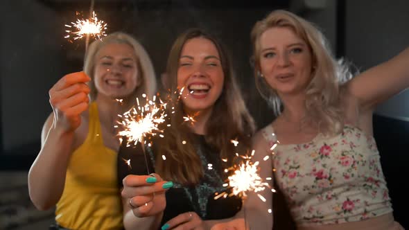 Three Secy Ladies Happy Dancing with Sparklers.