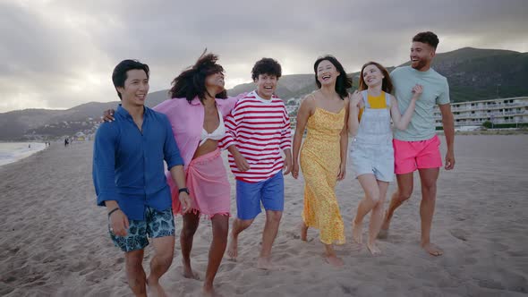 Group of friends having fun on the beach.