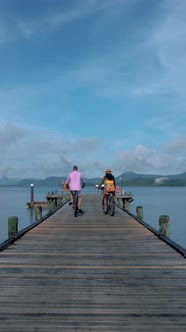 Couple Men and Woman on a Bike at a Tropical Island in Thailand Near Phuket Couple Man and Woman