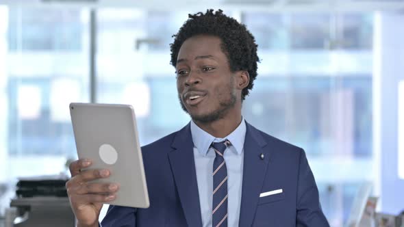 African American Businessman Doing Video Chat on Tablet