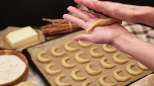 Woman Hands Closeup  Making Traditional German or Austrian Vanillekipferl Vanilla Kipferl Cookies