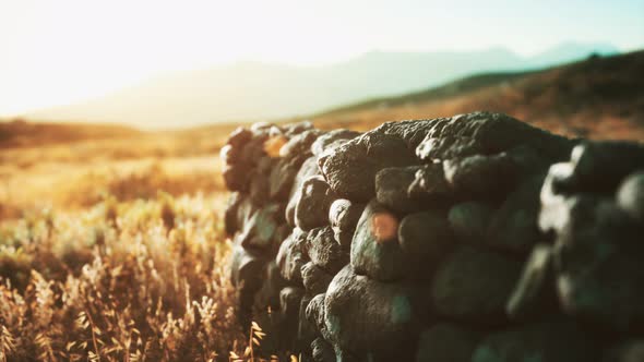 Scottish Land Border Stone Wall at Sunset