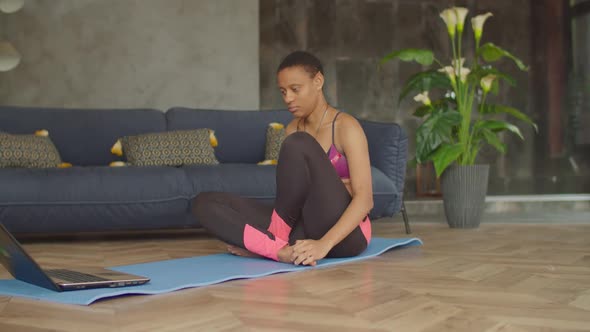 Sporty Fit Woman Doing Seated Forward Bend Exercise