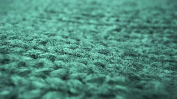 Extreme Detail View of Sheep Wool Cloth Texture Flowing in Macro Dolly Shot