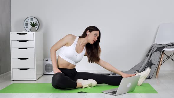 Happy Woman Doing Yoga with Online Trainer at Home Interior Background