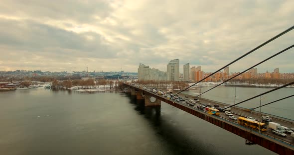 City Bridge Drone Aerial Fly.Aerial Car Rush Hour Street In Kyiv.Above View Kiev Ukraine Bridge.