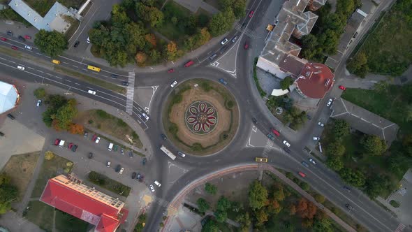  Aerial View of Roundabout Road with Circular Cars in Small European City at Summer Day