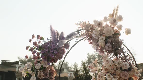 Medium Shot View of Wedding Floral Decorations of Flowers in Pastel Faded Colors Slow Motion Outside