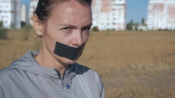 Woman Seals Her Mouth