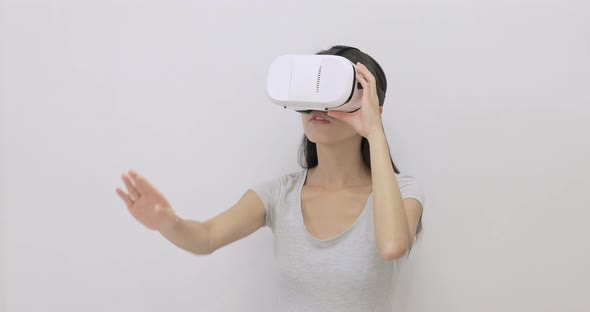 Excited Woman play game with VR device