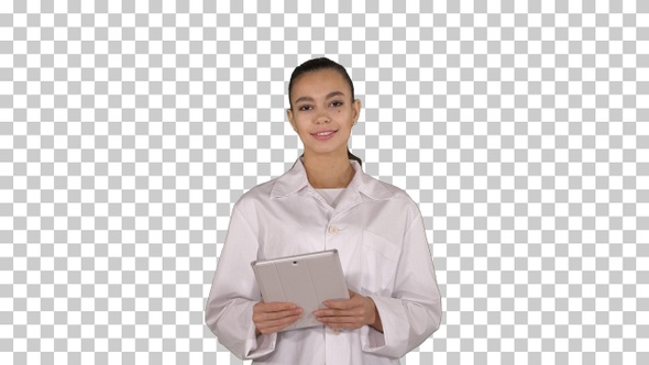 Happy female doctor using tablet computer swiping pages on it