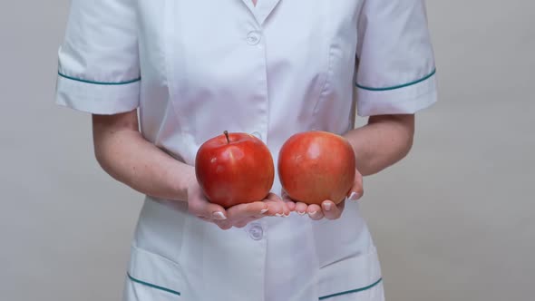 Nutritionist Doctor Healthy Lifestyle Concept - Holding Organic Red Apple