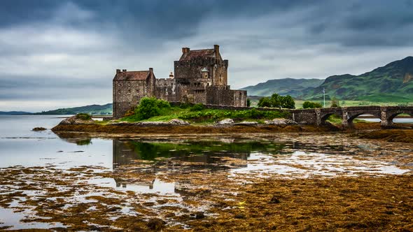 Eilean Donan Castle with tide on lake in Scotland, 4k, timelapse