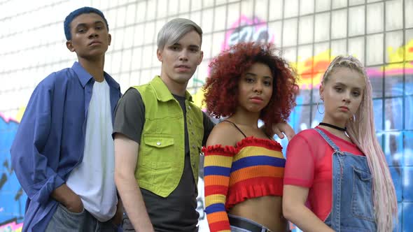 Multiracial Group of Teenagers Looking Camera on Graffiti Wall Background, Style
