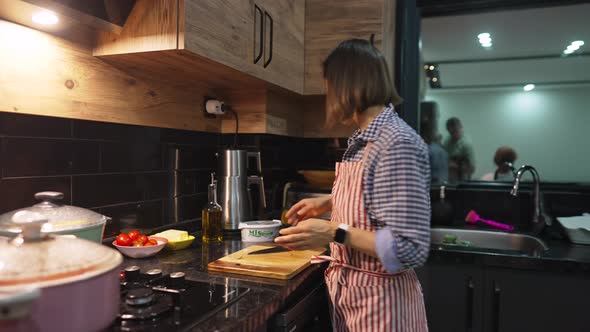 Caucasian Mother and Son Preparing Dinner Together at Home