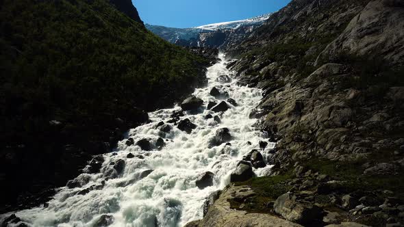 Mountain river from Buarbreen glacier in Folgefonna national park Norway.
