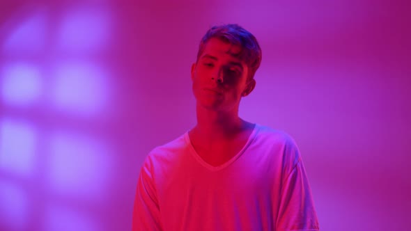 Young Attractive Man in Neon Light