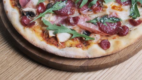 Appetizing Pizza on a Wooden Board in a Restaurant