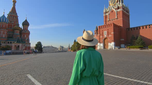 Girl in a green dress on Red Square. Russia Moscow