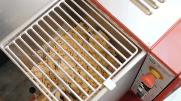 Man Using Pasta Machine to Prepare Dough for Tagliatelle Close Up View Modern Pasta Machine Kneaders