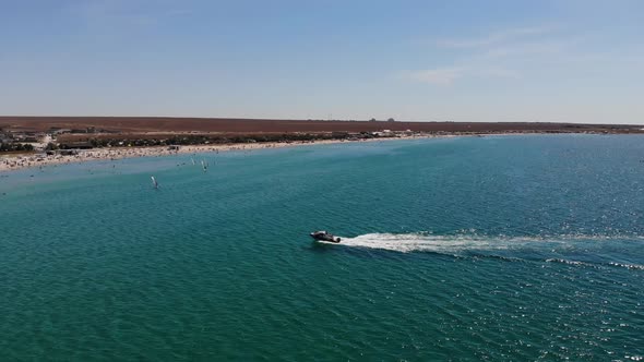 Aerial View of a Small Speed Boat in the Bay