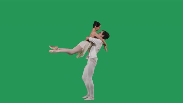 Professional Ballet Pair Practicing Moves on Green Screen