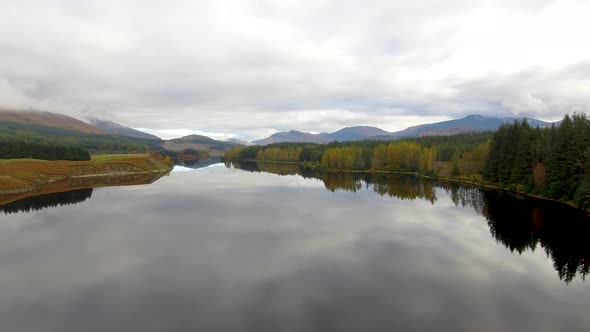 Aerial view of Laggan dam artificial lake and beautiful countryside and wood