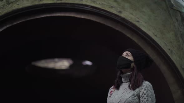 Young Woman in Protective Mask Watching Various Fish in Oceanarium