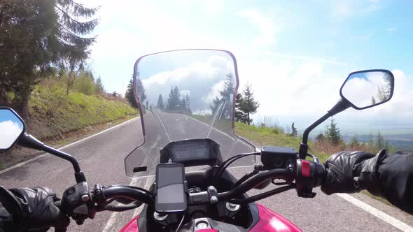 Motorcyclist Rides on a Beautiful Landscape Mountain Road in Slovakia, Serpentine Road