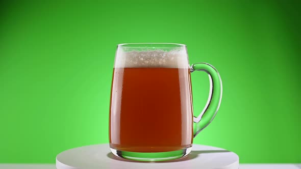 Rotating glass mug of beer