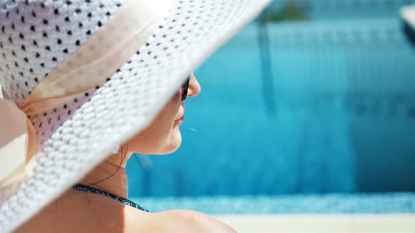 Back Side View Closeup Portrait Glamour Woman in Floppy Hat and Sunglasses Smiling and Enjoying