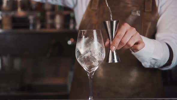 The Bartender Makes a Cocktail