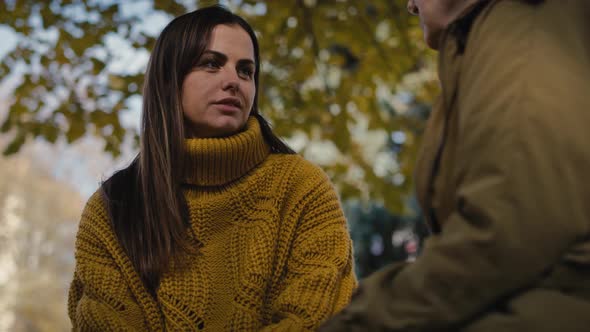 Close up caucasian woman talking with senior woman in park. Shot with RED helium camera in 4K