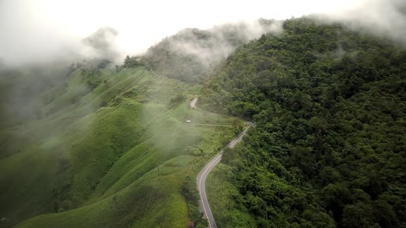 Countryside Road Passing Through The Mountain Landscape 