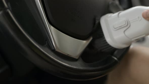 Close Up Shot of a Professional Cleaning Car Steering Wheel