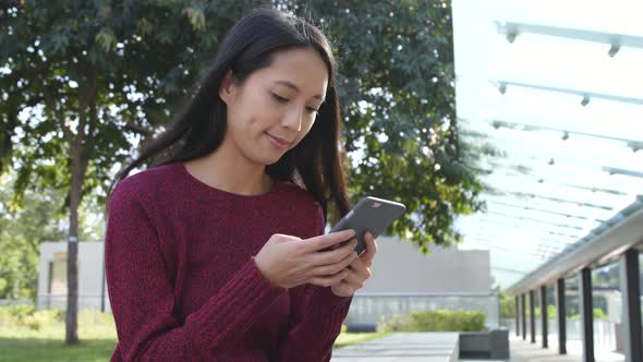 Woman using mobile phone at outdoor 