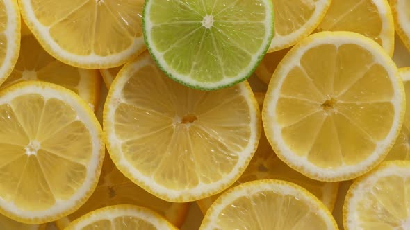 Lemon Slices with One Cut Lime Slice Closeup, Macro Food Summer Background