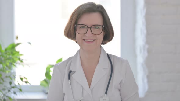 Senior Female Doctor Smiling at Camera