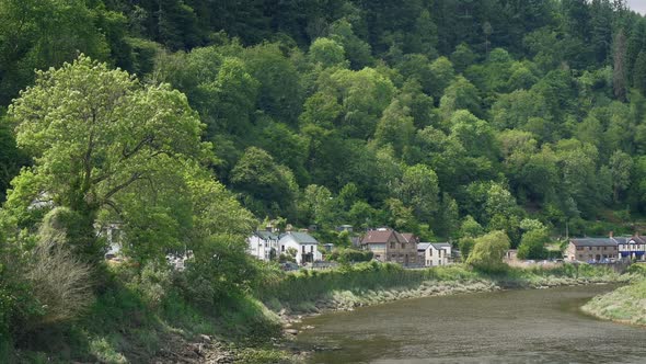 Pan Across Riverside Town In The Sun