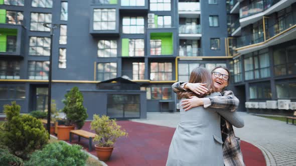 Two Happy Women Hug Each Other When Meeting After Long Separation