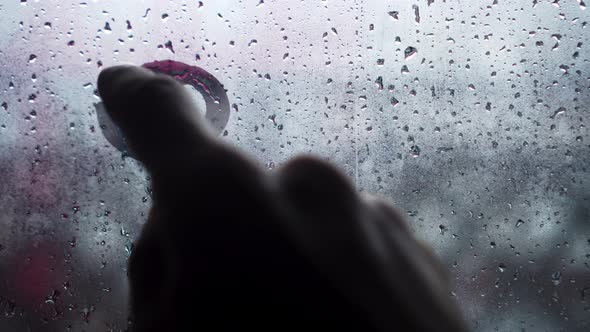 Handwritten inscription in English 911 on frosted fogged glass.