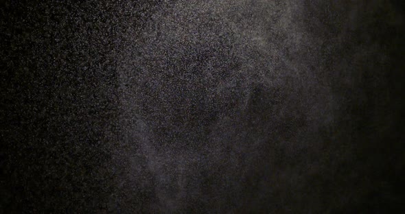 The Effect of Spraying Water on a Black Background Is Suitable To Replace in Your Video